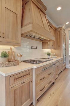 a kitchen with wooden cabinets and white counter tops, along with an island in the middle