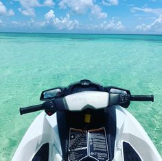 the front end of a motor boat in clear water