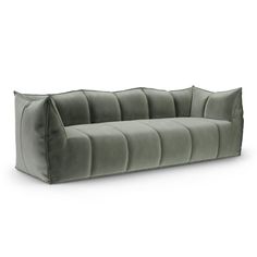 a beige velvet sofa on a white background