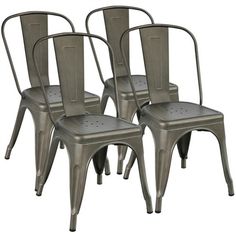 four metal chairs are shown in this image