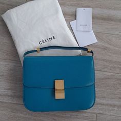 Authentic Celine Classic Bag From The Phoebe Philo Collection. Gorgeous Liege Leather In A Turquoise Blue With Gold Tone Hardware. Liege Leather Is Durable And Hard-Wearing! Removable And Adjustable Shoulder Strap. One Interior Zippered Pocket Inside An "Accordian-Style" Bag. Plenty Big For All Your Daily Essentials. Perfect For Everyday Wear. Timeless And Classic With A Fun Pop Of Color. Versatile And Practical Bag. Simple Yet Sophisticated. Understated Yet Chic. Quiet Luxury With Minimal Brand Designer Blue Square Bags, Luxury Blue Square Shoulder Bag, Classic Blue Bag With Original Box, Blue Square Bag For Formal Occasions, Blue Square Bags For Formal Occasions, Luxury Blue Shoulder Bag For Formal Occasions, Designer Blue Bag For Formal Occasions, Blue Square Bag With Gold-tone Hardware, Blue Square Bags With Gold-tone Hardware