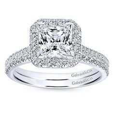 an engagement ring with a princess cut diamond in the center