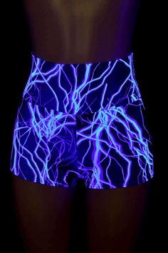 "This item is made to order, please read all the way through the listing before purchasing! Neon Blue Lightning print spandex is four way stretch for a great fit! The shorts have a high, anti muffin top waistband. UV glow and super duper neon under UV blacklight! LENGTH: 2.5\" inseam RISE: 11\" Womens Sizing (See below for instructions on where measurements should be taken) XXS: Bust 29\"-30\" / Waist 22\"-23\" / Hips 30\"-32\" Extra Small: Bust 31\"-32\" / Waist 24\"-25\" / Hips 33\"-35\" Small Stretch Rave Shorts, Neon Sports Bottoms, Fitted Rave Bottoms With Built-in Shorts, Fitted Rave Shorts, Blue Cheerleading Shorts, Blue Shorts For Cheerleading, Blue Elastane Shorts, Blue Stretch Shorts For Cheerleading, Blue Stretch Rave Bottoms