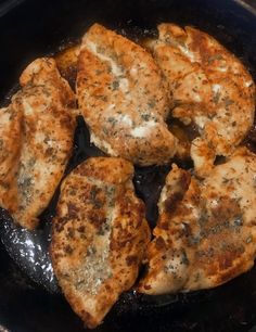 some chicken is cooking in a skillet