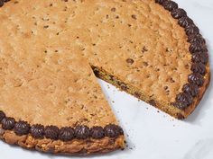 a chocolate chip pie with one slice cut out