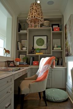 a home office with a desk, chair and bookshelf