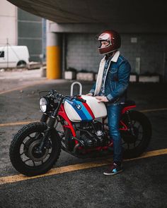 a man sitting on top of a motorcycle