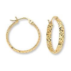 These stylish hoop earrings for her are textured with an exciting diamond-cut pattern. The earrings are fashioned in 14K yellow gold and secure with hinged backs. Textured Yellow Gold Round Hoop Earrings, Textured Yellow Gold Hoop Earrings, Textured 14k Yellow Gold Jewelry, Textured Yellow Gold Round Jewelry, Textured Round Jewelry For Anniversary, Xmas Wishlist, Jewelry Advice, Jewelry Education, Jared The Galleria Of Jewelry