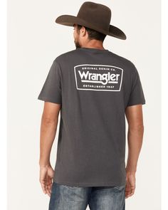 Short sleeve. Rib knit crew neck. Wrangler logo on left chest. "Wrangler / Original Denim Co. Established 1947" graphic on back. Outdoor Cotton Crew T-shirt, Casual Tops With Logo Patch And Crew Neck, Casual Tops With Logo Patch And Relaxed Fit, Casual Relaxed Fit Top With Logo Patch, Casual Crew Neck T-shirt With Front Logo, Casual Short Sleeve T-shirt With Front Logo, Outdoor Crew-neck Cotton T-shirt, Cotton Crew Neck T-shirt For Outdoor, Casual Gray Logo Tops