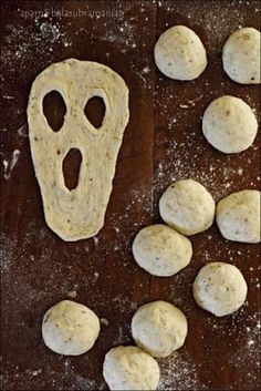 bread dough with holes cut into the shape of a ghost