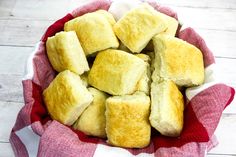 a red and white basket filled with cut up bread