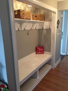 a room with some shelves and baskets on the wall