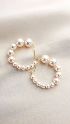 Life's beginnings of small but meaningful steps to grow as one journeys on through the circle of life - Hebe are the name of these lustrous statement pearl hoops. For it is she, the goddess of life at its prime we yearn to live. © JeannieRichard Handcrafted with: Swarovski Crystal Pearls 18k gold hoops (nickle+lead free) White Pearl Round Hoop Earrings, Goddess Of Life, Pearl Earrings Handmade, The Circle Of Life, Stacked Necklaces, Circle Of Life, Sea Pearls, Beaded Tassels, The Goddess