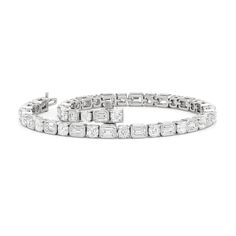 Versatile enough for every occasion and season, this diamond tennis bracelet pairs effortlessly when dressed up or down. It has the seamless blend of effortless elegance and timeless style with its combination of cushion diamonds on v-prongs and emerald-cut diamonds on bezels. Classic Platinum Diamond Bracelet With Baguette Diamonds, Classic Baguette Cut Tennis Bracelet, Classic Diamond Bracelet With Baguette Diamonds For Anniversary, Modern Diamond Tennis Bracelet With Baguette Cut, Classic Diamond Tennis Bracelet Baguette Cut, Timeless Baguette Cut Diamond Bracelet, Classic Tennis Bracelet With Baguette Diamonds, Timeless Platinum Tennis Bracelet With Baguette Diamonds, Timeless White Gold Tennis Bracelet With Baguette Cut