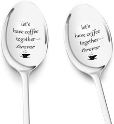 two spoons with words on them sitting side by side in front of each other