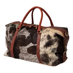 The Huntley Equestrian Cowhide Leather Travel Duffle bag is made of premium top grain cow leather and professionally tanned cowhide hair. Hand crafted, machine sewn, and designed with a traditional elegance but rugged enough for every day use. The Huntley Classic Pony Hair print leather is an essential to your travel bag collection. The stylish weekend or overnight bag is made to carry all of your daily or weekend items. The Huntley Cowhide duffle is made of beautiful, supple 100% leather with a Hair Print, Cowgirl Accessories, Leather Duffel Bag, Leather Duffel, Cowhide Bag, Leather Weekender, Travel Duffle Bag, Travel Tote Bag, Travel Duffle