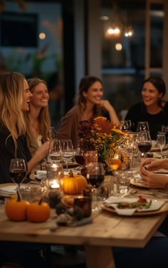 a group of people sitting around a table with wine glasses