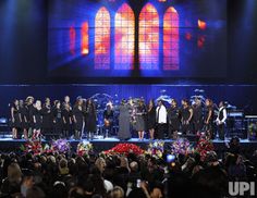 a group of people standing on top of a stage