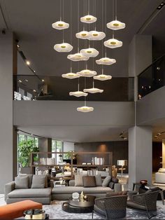 a living room filled with furniture and lots of lights hanging from it's ceiling