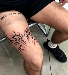 a man with a tattoo on his leg