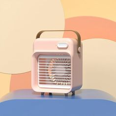 an air conditioner sitting on top of a table next to a colorful wallpaper