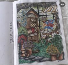 the book is open to show an image of a garden with potted plants and flowers