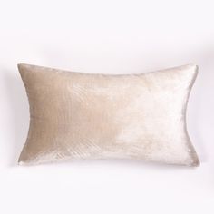 a white pillow sitting on top of a table