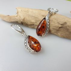 Natural Baltic Amber and sterling silver 925 earrings. Green or broun Amber colour. All Sterling silver parts with hallmarks on it. Length 4 cm. Nice mother's day gift. https://www.etsy.com/shop/AmberLithuania?ref=simple-shop-header-name&listing_id=780205095&section_id=27948198 This item was made of natural Baltic Amber. All the amber used in my jewelry is collected in my home country Lithuania. I sell only genuine, real, not pressed, authentic, natural Baltic Amber. Item may have natura Formal Brown Sterling Silver Earrings, Elegant Brown Sterling Silver Earrings, Formal Amber Sterling Silver Jewelry, Brown Sterling Silver Drop Earrings, Silver And Amber Earrings, Elegant Amber Sterling Silver Earrings, Classic Amber Sterling Silver Earrings, Amber Sterling Silver Drop Earrings, Amber Sterling Silver Earrings