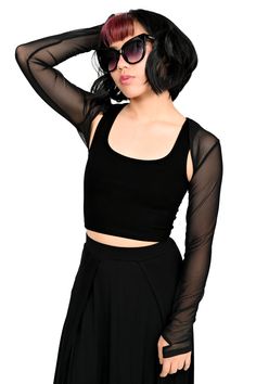 Our Signature Bolero, now in our soft 4 way stretch black mesh you know and love! A wardrobe staple. Perfect for a cool evening to throw over any of our classic cut dresses or tops. Wear it under a band t-shirt for extra layering. This is just for the bolero! It is a long sleeve shrug and does not include the dress. Models are wearing size XS and 2XL. Fits true to size. Part of the Foxblood Signature Collection. Designed by us in Los Angeles, California and made in our privately owned boutique f Trendy High Stretch Mesh Top For Party, Trendy High-stretch Mesh Top For Party, High Stretch Trendy Mesh Top For Party, Alternative Stretch Tops For Clubbing, Alternative Stretch Top For Club, Stretch Mesh Top For Club In Fall, Edgy Top With Mesh Sleeves For Night Out, High Stretch Mesh Top For Party, Stretch Crop Top With Mesh Sleeves For Summer