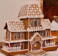 a large gingerbread house is on the table