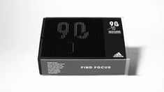 a black box with the number 90 printed on it's front and back side