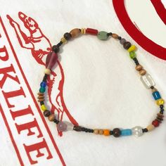 Blur Damon Albarn Inspired Glass Bead Necklace Retro Wooden Bead Jewelry, Retro Handmade Necklaces For Festival, Retro Wooden Round Bead Jewelry, Handmade Retro Necklaces For Festival, Retro Handmade Necklace For Festival, Handmade Retro Necklace For Festival, Handmade Retro Necklace For Festivals, Retro Multicolor Adjustable Necklaces, Retro Multicolor Necklaces For Jewelry Making