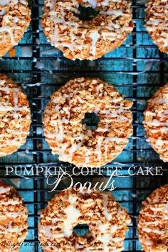 pumpkin coffee cake doughnuts on a cooling rack with the words pumpkin coffee cake