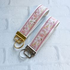 Cherry Blossom Vegan Leather Wristlet Keychain Key chain, Bridesmaid Gift Idea Gifts Under 20 For Her, Wristlet key fob, lanyard fob You are purchasing ONE wristlet keychain as shown in the photos above.  Designed with a combination of vegan leathers, this wristlet features an appliquéd center that can be monogrammed or personalized for an additional fee.   This wristlet is 5x1.25" not counting the hardware.   Due to the nature of the different vinyls, pattern placement will vary.  No two are ex Wrist Lanyard Aesthetic, Car Key Keychain, Wristlet Keychain Ideas, Key Chains Aesthetic, Car Keys Keychain Ideas, Cute Keychains For Car Keys, Car Keychain Ideas, Leather Wristlet Keychain, Cute Keychains