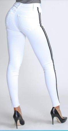 Flex your style in these cute white skinny Jeans with a contrast black stripe design. Perfect for styling any and every way you want! These jeans come in a high rise fit featuring a raw uneven hem ends, zip and button closure. Pair with a graphic tee or chic fashion top, high heels or combat boots and of course a handbag for a complete look! Stretch Material Comfortable Contrast side stripe design Raw uneven hem. Rise: 10.5" Inseam: 28" 49% Siro, Rayon, 32% Lyocell, 17% Polyester, 2% Spandex Lyc Celebrity Jeans, Fashion Top, Chic Fashion, Side Stripe, Stripes Design, Black Stripes, White Jeans, Combat Boots, Chic Style