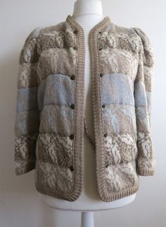 "Luxurious knitted and quilted jacket with golden lurex threads going all through. Butterfly pattern all over. The colors are shades of beige, white and blue. The color shift comes in horizontal stripes. Remember that there is that golden lurex as well! The jacket is hip length, got high crew neck and puffy sleeves. It's lined and and got snaps up the front. Estimated size Small for relaxed fit. The dress shape is Medium, and the jacket is clearly too small for it. Please check the measurements: armpit  ~ 94 cm  /  ~ 37 \" waist  ~ 94 cm  /  ~ 37 \" length  ~ 64 cm  /  ~ 25 \" bottom circumference  ~ 94 cm  / ~ 37 \" shoulder to shoulder  ~ 34 cm  /  ~ 13 \" In great vintage condition." Cozy Wool Outerwear With Jacquard Knit, Cozy Wool Jacquard Knit Outerwear, Cold Weather Wool Outerwear With Jacquard Knit, Beige Jacquard Knit Long Sleeve Outerwear, Fitted Wool Jacquard Knit Outerwear, Fitted Wool Outerwear With Jacquard Knit, Winter Cream Cable Knit Outerwear, Long Sleeve Jacquard Knit Outerwear, Cozy Jacquard Knit Winter Outerwear