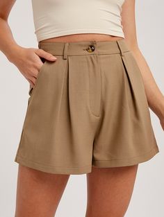 Woven bottom shorts with button and zipper closure - Pleat detail on front - Elastic band on center back with belt loop - Side pockets on the back - Finished with clean hem - Model is 5' 10" 33-24-35 and wearing a size Small Fabric: 96% polyester & 4% spandex **THIS ITEM IS A FINAL SALE ITEM. NO RETURNS OR EXCHANGES ALLOWED** Trendy Solid Color Shorts With Button Closure, Trendy Solid Shorts With Button Closure, Short Bottoms With Belt Loops, Spring Shorts With Button Closure And Short Inseam, Trendy Short Skort With Belt Loops, Summer Skort With Belt Loops And Short Length, Casual Short Skort With Button Closure, Fitted High-waisted Shorts With Button Closure, High-waisted Shorts For Work With Button Closure