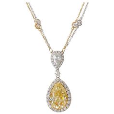 Ninacci Couture 18 karat yellow and white gold halo pendant necklace containing a 10.13 carat pear modified brilliant Fancy Yellow diamond center stone, 1.01 carat pear modified brilliant accent stone, and 62 round brilliant side stones that have a combined total weight of 2.88 carats. The Gemological Institute of America (GIA) has graded the center diamond as Fancy Yellow with natural color origin and even color distribution. This exceptional Fancy Yellow color, VS1 clarity diamond is set in a Halo Necklace, Fancy Yellow Diamond, Lose Yourself, Antique Pendant, Halo Pendant, Breathtaking Beauty, Jewelry Diamond, Pearl Pendant Necklace, Pear Diamond