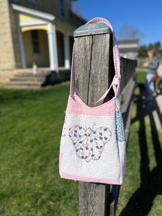 🦋 Embrace Vintage Charm with Our Butterfly Motif Tote Bag! 🌸 Indulge in the beauty of yesteryears with our repurposed vintage quilt tote bag, exquisitely adorned with a delicate butterfly motif in serene pink and white tones. Each stitch tells a story of timeless elegance and eco-conscious fashion. ✨ Key Features: - Vintage quilt repurposed into a unique tote bag - Butterfly motif in soft pink and white hues - Durable construction for everyday use - Spacious interior perfect for your essentials Carry a piece of history with you as you go about your day, knowing that your style reflects sustainability and a love for heritage craftsmanship. 🛍️ Limited edition. Embrace vintage. #RepurposedVintage #ButterflyMotif  --- Quilt Tote Bag, Unique Tote Bag, Butterfly Motif, Delicate Butterfly, Quilted Tote Bags, Repurposed Vintage, Vintage Quilt, Quilted Totes, Patchwork Bags