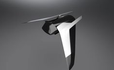 a futuristic black and white object on a gray background