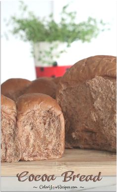 several loaves of bread sitting on top of a cutting board