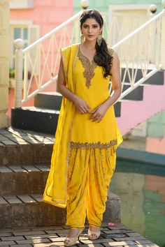 Yellow Georgette Patiala Dhoti Style Shalwar Suit at PinkPhulkari Designer Palazzo Set With Traditional Drape And Pallu, Traditional Sleeveless Cutdana Salwar Kameez, Designer Dabka Saree For Diwali, Traditional Sleeveless Palazzo Set For Navratri, Georgette Palazzo Set With Pallu In Traditional Drape, Traditional Draped Palazzo Set With Pallu In Georgette, Traditional Drape Palazzo Set With Pallu, Traditional Drape Saree With Dabka Embroidery, Designer Wear Dabka Saree Traditional Drape