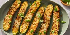 an oval plate filled with grilled zucchini