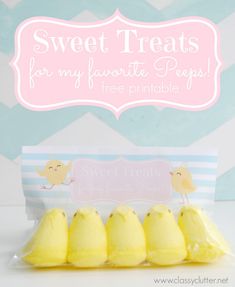 there are four peeps in the package on the table, and one is yellow