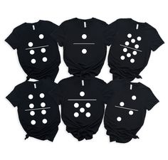 six black shirts with white polka dots on them