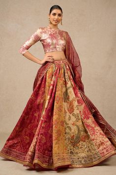 Multi color flared lehenga with all over contrast vintage print and stone embellished borders. Paired with foil jersey printed blouse and contrast printed sheer silk dupatta with lace work border.
Components: 3
Pattern: Printed and Embellished
Type Of Work: Vintage Print, Stone and Lace Work
Neckline: Closed Round Neck
Sleeve Type: Three Quarter Sleeves
Fabric: Lehenga: Kasab Satin, Blouse: Foil Jersey, Dupatta: Sheer Silk
Color: Multi Color
Other Details: 
Lace work border details
Stone embelli Multicolor Ceremonial Choli For Festive Occasions, Bohemian Choli For Ceremonial Occasions, Bohemian Ceremonial Choli, Festive Ceremonial Multicolor Choli, Festive Multicolor Ceremonial Choli, Bohemian Brocade Dupatta For Wedding, Ceremonial Sets With Unstitched Blouse, Bohemian Wedding Traditional Wear With Unstitched Blouse, Festive Multicolor Sharara For Ceremonial Occasions