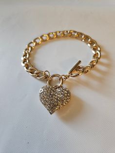 Very nice heart bracelet with toggle. See photos for measurements. Heart Shaped Bracelet With Toggle Clasp As Gift, Heart-shaped Charm Bracelet With Toggle Clasp As Gift, Heart Charm Bracelet With Toggle Clasp For Gift, Metal Heart Bracelet With Toggle Clasp As Gift, Heart Shaped Toggle Clasp Bracelet For Gift, Valentine's Day Heart Bracelet With Toggle Clasp, Valentine's Day Gift Heart Bracelet With Toggle Clasp, Metal Heart Bracelet With Toggle Clasp, Heart-shaped Charm Bracelet With Lobster Clasp