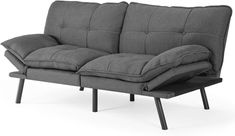 a gray couch sitting on top of a wooden frame