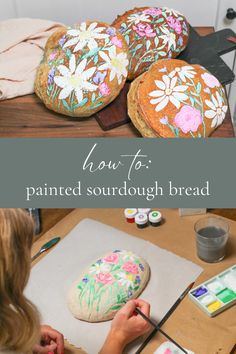 a woman is painting flowers on some bread