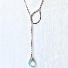 This necklace is delicate and lovely.  Gold filled chain is attached to a hand forged and hammered teardrop link and aquamarine quartz stone. The total length is @ 20"...can be shortened to 18" for the petite girl. ;)Please let me know if you would like the total length longer, up to 21" with no extra charge.Special and delicate, you can wear this everyday and even layer with other dainty pieces.This is also made in sterling.  :)***This necklace does not have a clasp.  To keep the chain secure, Adjustable Teardrop Lariat Necklace, Adjustable Teardrop Jewelry With Delicate Chain, Adjustable Teardrop-shaped Jewelry With Delicate Chain, Hand Forged Teardrop Pendant Necklace, Hammered Teardrop Necklace For Gift, Delicate Hammered Teardrop Jewelry, Dainty Hammered Teardrop Jewelry, Everyday Necklace Gold, Aquamarine Necklace